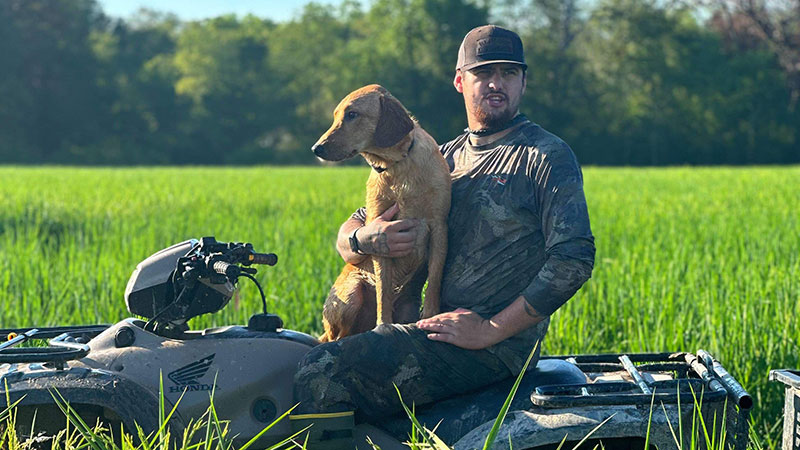 Ben Clark and his dog Rip on the opening day of teal season in Lyons Point, Louisiana.