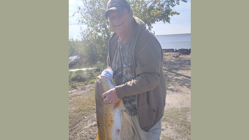 Jim Naegele with a bull red from the Mermentau River.