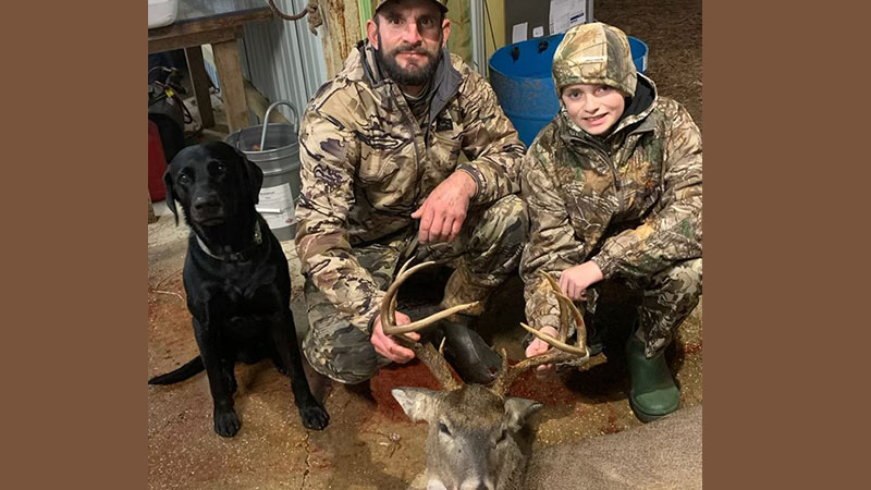 Caleb Rodrigue and 8-point buck