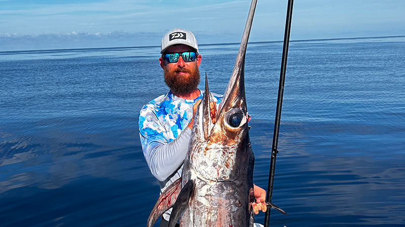 Capt. Alex Sevin with 120-pound swordfish