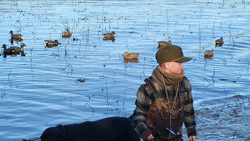Grayson Edwards gathering green-winged teal