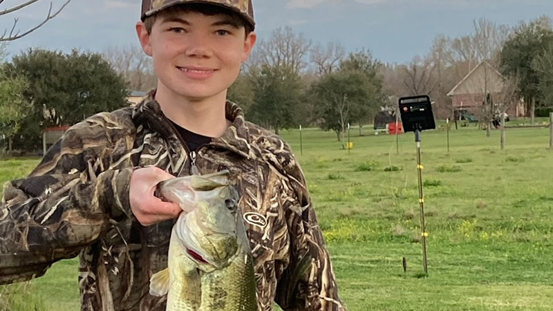Andrew and Rex with a bass
