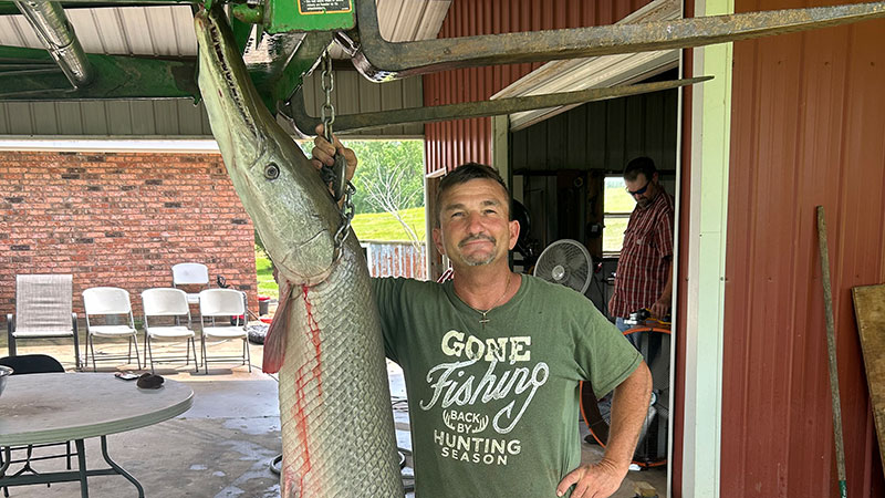 Alsey Lachney with his alligator gar